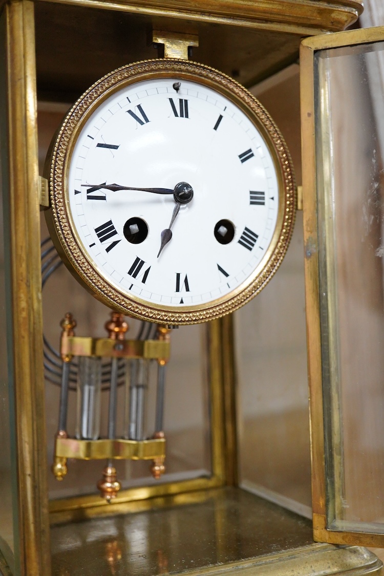 A late 19th century French brass four glass mantel clock, 25.5cm high